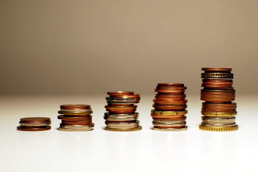 Photo by Kamil Stacks of coins increasing in height from left to right